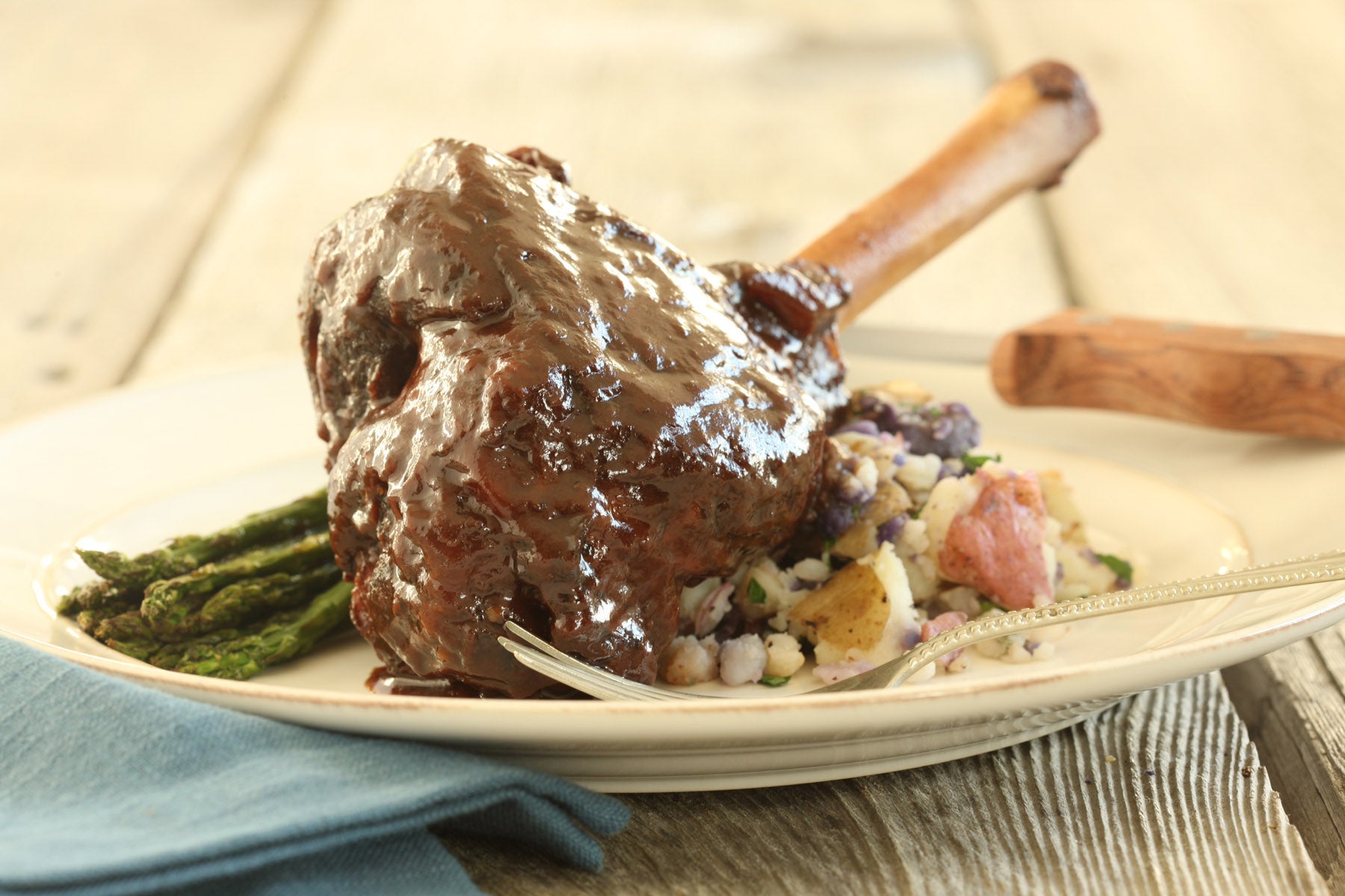 Braised American Lamb Shanks with Herb-smashed Baby Potatoes & Roasted Asparagus