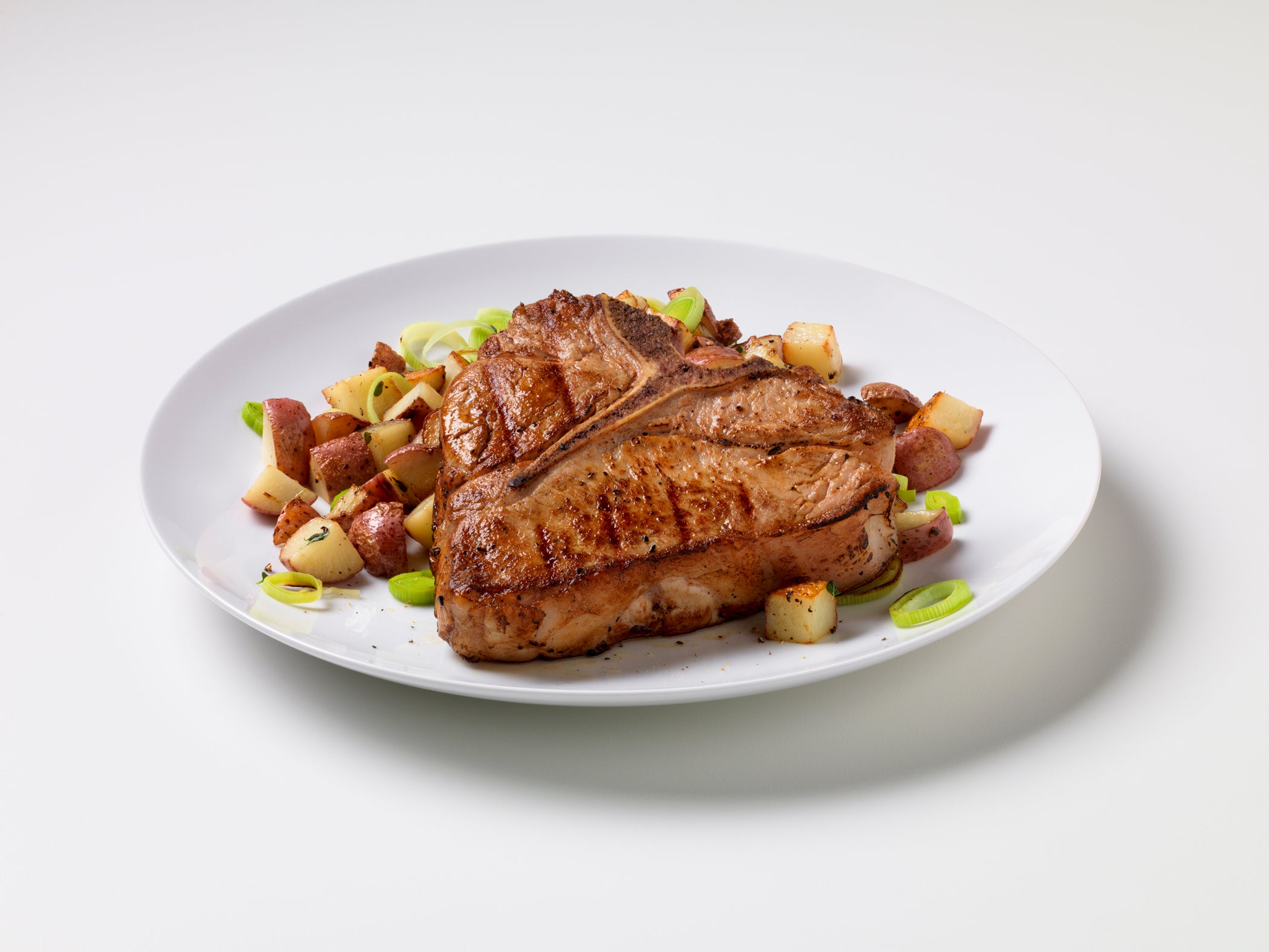 Grilled Veal Chops with Potato-Leek Hash