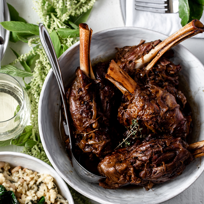 Balsamic & Caramelized Onion Braised American Lamb Shanks over White Bean & Winter Greens Risotto